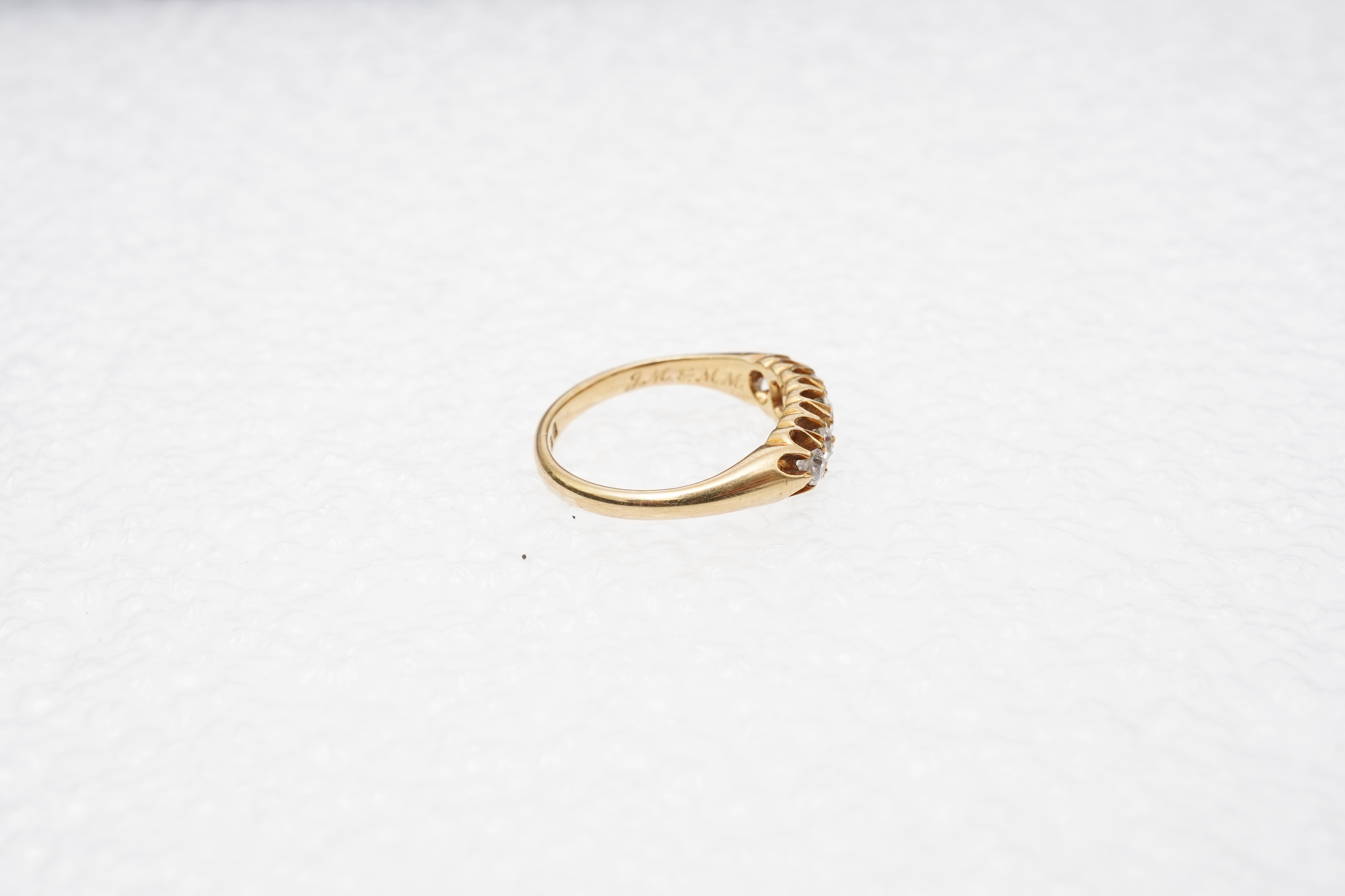 An Edwardian five-stone diamond ring, circa 1903